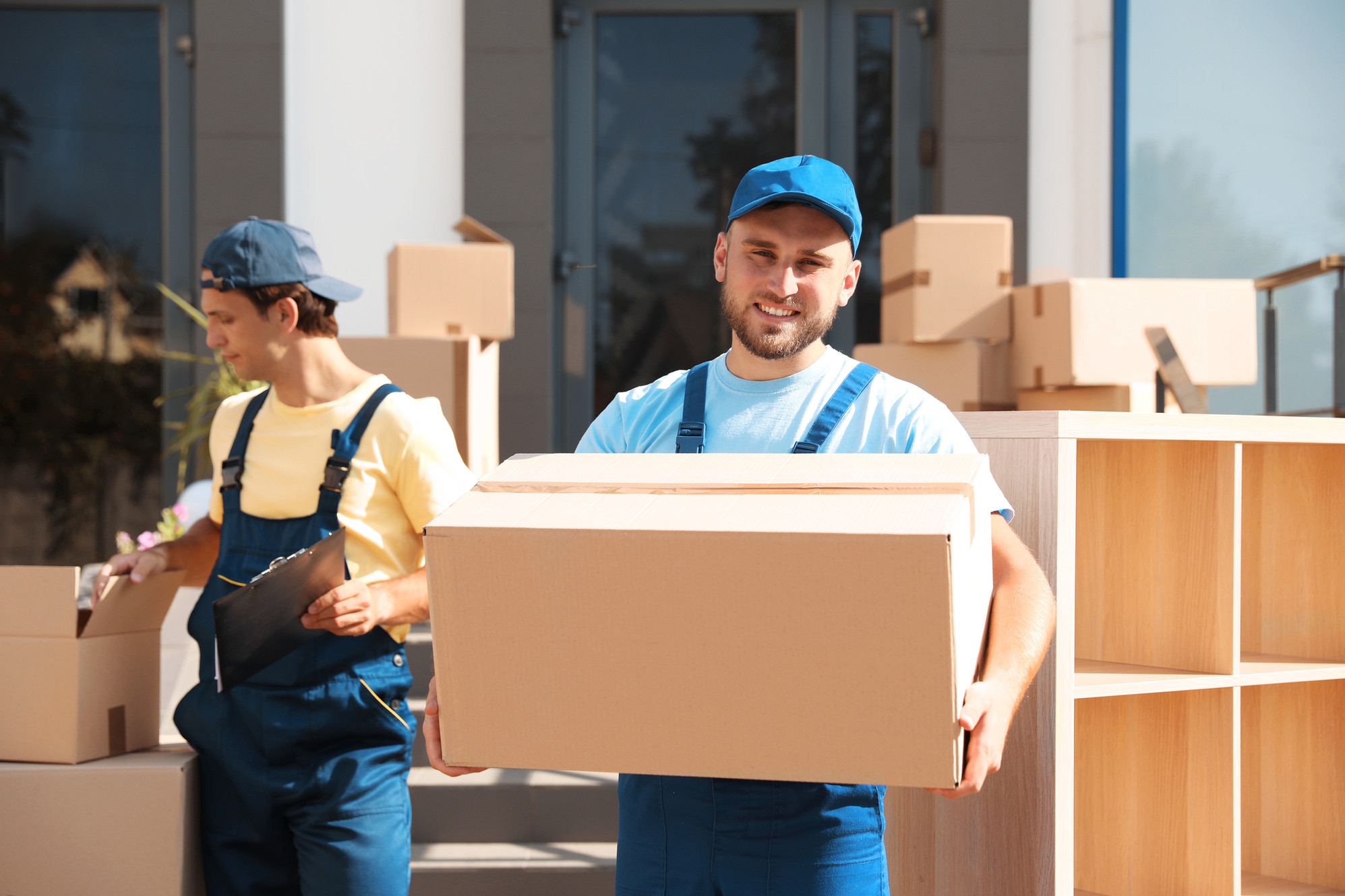 Expert movers from Mainland Connection in action, showcasing the team's dedication to seamless and careful moving services.